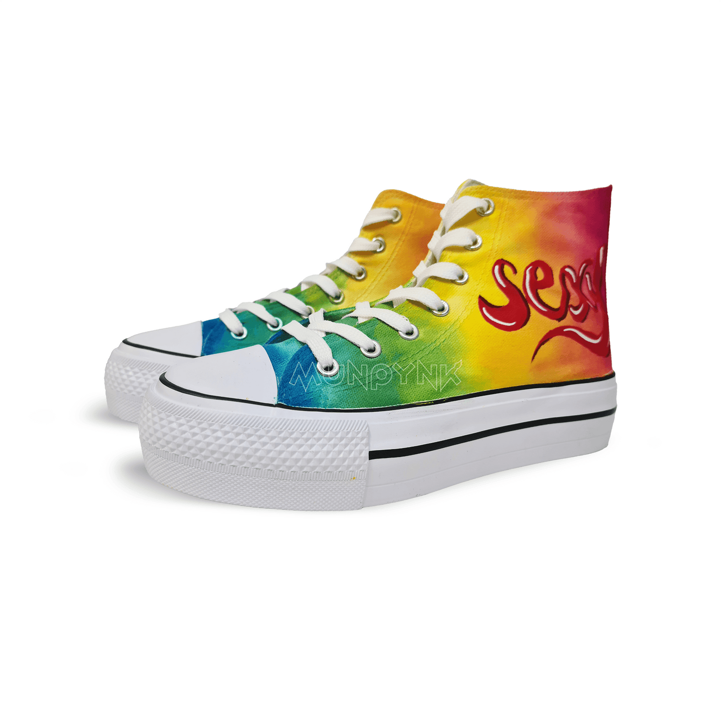 Zapatillas pintada de tela con fondo arcoiris , cordones y suela de plataforma blanca. Pintada con dibujo de boca en un lado y la palabra sexy en el otro